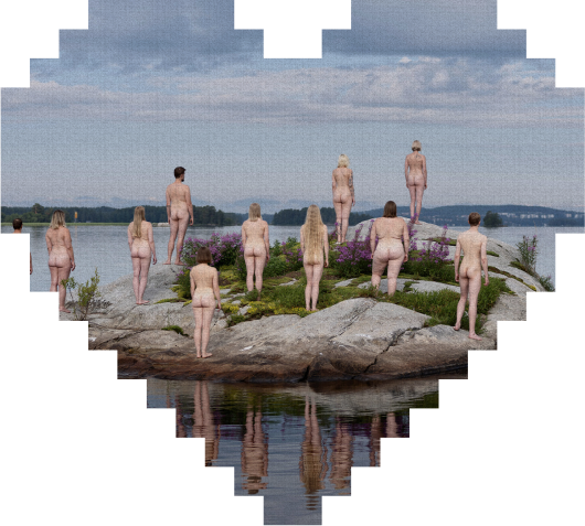 A group of nude people stand on a rocky island by a lake, facing away. The scene is framed in the shape of a heart, with reflections visible in the water. The background shows cloudy skies and distant land.