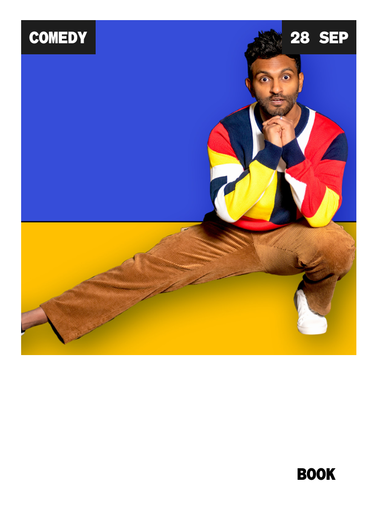 A man in a colorful sweater and brown pants sits cross-legged, chin resting on his fists, against a blue and yellow backdrop. Text reads "Comedy 28 Sep Nazeem Hussain Totally Normal – Encore." A "Book" button is visible.