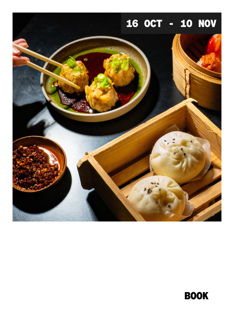 A hand holds chopsticks over a plate of dumplings in sauce, with steamed buns in a wooden box and a bowl of chili oil nearby. "16 OCT - 10 NOV" and "NIGHT FEAST" are shown, with a "BOOK" button at the bottom.