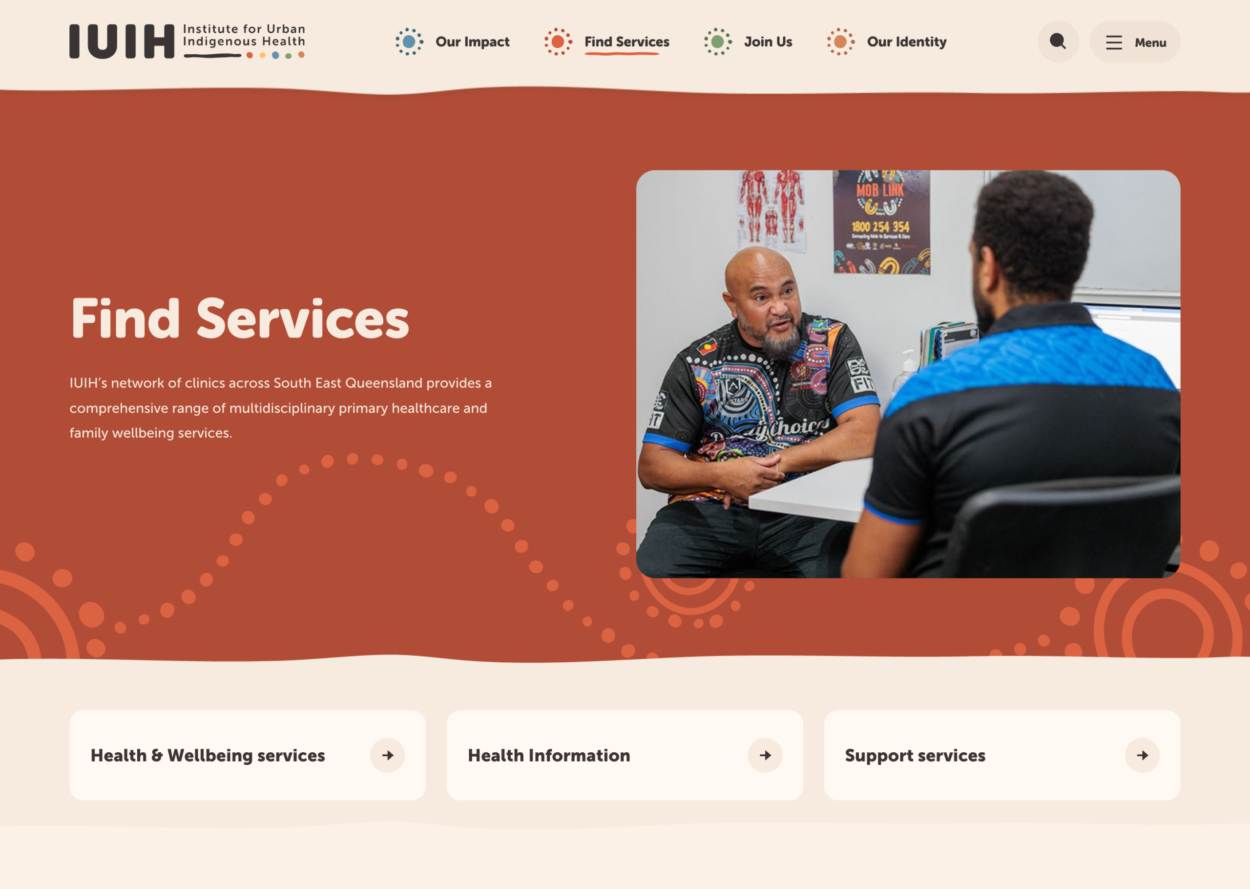 A screenshot of the IUHI Find Services webpage shows two people talking across a desk. The page highlights health, wellbeing, and support services with navigation buttons and a brown background.