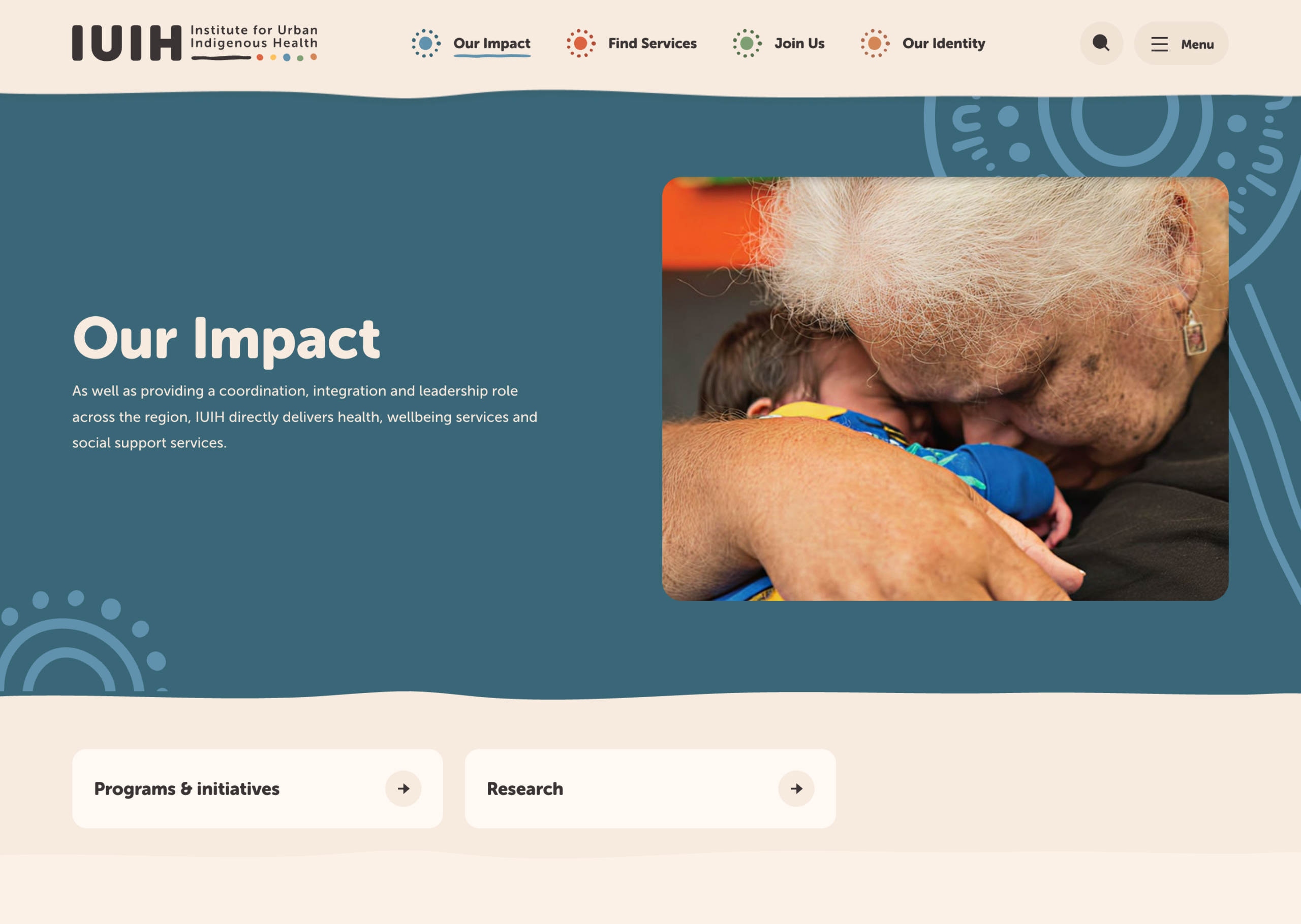 A white-haired woman lovingly embraces and kisses a young child on the cheek. The image is on a website titled "Our Impact" for the Institute for Urban Indigenous Health (IUIH).